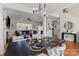 Elegant dining room with hardwood floors and an open view of the living room and entry at 6645 Allness Glen Ln, Charlotte, NC 28269