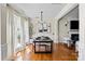 Dining room with hardwood floors, fireplace and ample natural light at 6645 Allness Glen Ln, Charlotte, NC 28269