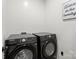 Modern laundry room with front-loading washer and dryer at 6645 Allness Glen Ln, Charlotte, NC 28269
