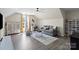 Spacious living area with a ceiling fan, hardwood floors, and plenty of natural light at 6645 Allness Glen Ln, Charlotte, NC 28269