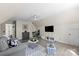 Spacious living room featuring vaulted ceilings, a ceiling fan, hardwood floors, and a gray sofa at 6645 Allness Glen Ln, Charlotte, NC 28269