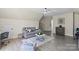Comfortable living room featuring hardwood floors, a gray sofa, and stylish decor at 6645 Allness Glen Ln, Charlotte, NC 28269