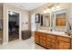 Bathroom with dual sinks and walk-in closet at 707 Sinclair Dr, Monroe, NC 28112