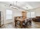 Inviting dining room with modern lighting, wood-look flooring, and ample seating for Gathering gatherings at 707 Sinclair Dr, Monroe, NC 28112