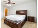 Main bedroom with a wooden bed, storage drawers and a ceiling fan at 707 Sinclair Dr, Monroe, NC 28112