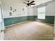 Bedroom featuring animal decals, carpeted floor, and half paneled walls at 707 Sinclair Dr, Monroe, NC 28112