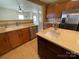 Spacious kitchen featuring stainless steel dishwasher and large sink in the island at 707 Sinclair Dr, Monroe, NC 28112