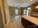 Open kitchen featuring an island, tile floors, and a bright eating area at 707 Sinclair Dr, Monroe, NC 28112