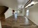 Bright living room featuring modern floors, lighting, and an open floor plan at 707 Sinclair Dr, Monroe, NC 28112