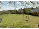 Spacious backyard with a bird bath and green lawn at 7780 Stokes Ferry Rd, Salisbury, NC 28146