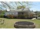 Back exterior featuring a wood deck and light gray siding at 7780 Stokes Ferry Rd, Salisbury, NC 28146