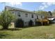 Back exterior featuring a wood deck and light gray siding at 7780 Stokes Ferry Rd, Salisbury, NC 28146