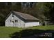 Rustic barn featuring a metal roof, offering ample storage space and potential for various uses at 7780 Stokes Ferry Rd, Salisbury, NC 28146