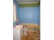 Charming half bath with light blue walls and floral wallpaper accents the space at 7780 Stokes Ferry Rd, Salisbury, NC 28146