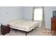 Serene bedroom with a soft blue color scheme and ample natural light at 7780 Stokes Ferry Rd, Salisbury, NC 28146