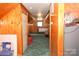 Spacious bonus room featuring wood walls and carpet at 7780 Stokes Ferry Rd, Salisbury, NC 28146