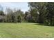 Expansive front lawn with mature trees offers a serene setting at 7780 Stokes Ferry Rd, Salisbury, NC 28146