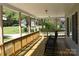 Inviting front porch with rocking chairs, great space for relaxing outdoors at 7780 Stokes Ferry Rd, Salisbury, NC 28146