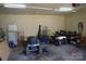 Spacious garage interior featuring a variety of tools and equipment at 7780 Stokes Ferry Rd, Salisbury, NC 28146