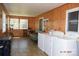 Functional laundry room with wood paneling, washer, dryer, and plenty of natural light at 7780 Stokes Ferry Rd, Salisbury, NC 28146