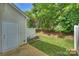 Well-maintained backyard with white fence and lush greenery, creating a private outdoor space at 8453 Big Creek Ct, Charlotte, NC 28105