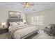 Cozy primary bedroom with vaulted ceiling, neutral decor, and bright natural light at 8453 Big Creek Ct, Charlotte, NC 28105