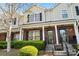 Charming townhomes featuring brick accents, neutral siding, well-maintained landscaping, and inviting front entrances at 8453 Big Creek Ct, Charlotte, NC 28105