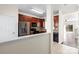 Modern kitchen boasts stainless steel appliances, dark wood cabinetry, and tile backsplash at 8453 Big Creek Ct, Charlotte, NC 28105