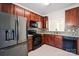 Updated kitchen with stainless steel appliances, granite counters, and mosaic tile backsplash at 8453 Big Creek Ct, Charlotte, NC 28105