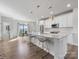 Bright kitchen featuring quartz countertops, stainless steel appliances, pendant lighting and dining area at 8707 Nolley Ct, Charlotte, NC 28270