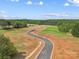 Aerial view of new community with paved roads and tree line at 1026 Mapletree Ln, Indian Trail, NC 28079