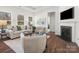 Cozy living room boasting hardwood floors, fireplace, neutral decor, and recessed lighting at 1026 Mapletree Ln, Indian Trail, NC 28079