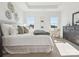 Beautifully decorated main bedroom with lots of light, neutral carpet, and tray ceiling at 1026 Mapletree Ln, Indian Trail, NC 28079
