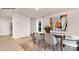 Dining room with stylish table, chairs, modern art, and light-colored wood-look flooring at 1036 Hostler Ln, York, SC 29745