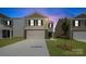 Charming two-story home with stone accents, a spacious driveway, and manicured lawn at 1036 Hostler Ln, York, SC 29745