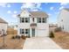 Charming two-story home with a well-manicured lawn and a blue door with beautiful curb appeal at 111 Buoy Ln # 392, Statesville, NC 28677