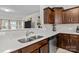 Kitchen boasts stainless steel sink, modern countertops, and open view to the living area at 111 Buoy Ln # 392, Statesville, NC 28677