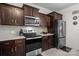 Modern kitchen showcasing stainless steel appliances, wooden cabinetry, and stylish countertops at 111 Buoy Ln # 392, Statesville, NC 28677