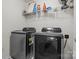 Modern laundry room with washer, dryer and ample shelving space at 111 Buoy Ln # 392, Statesville, NC 28677