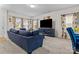 Bright living room featuring a large sofa, modern decor, and ample natural light at 111 Buoy Ln # 392, Statesville, NC 28677