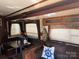 A living room with wood trim, window, sofa, and table at 120 Cherokee Trl, Mount Gilead, NC 27306