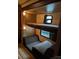 Cozy bedroom area with bunk beds and seating at 120 Cherokee Trl, Mount Gilead, NC 27306