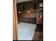 Cozy bedroom featuring under cabinet lighting, overhead storage, and a comfortable mattress at 120 Cherokee Trl, Mount Gilead, NC 27306