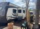 Well-maintained RV with outside grill and furniture at 120 Cherokee Trl, Mount Gilead, NC 27306