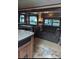 Comfortable living room area with a plush sofa, booth seating, and dinette area at 120 Cherokee Trl, Mount Gilead, NC 27306