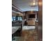 Open living area with entertainment center and tile floors at 120 Cherokee Trl, Mount Gilead, NC 27306