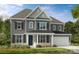 Charming two-story home with a gray exterior, well-manicured lawn, and attached two-car garage at 13408 Chopin Ridge Rd, Huntersville, NC 28078