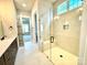 Bright bathroom featuring a glass shower with bench seating and marble-look tile floors at 174 Fulworth Nw Dr # 65, Concord, NC 28027