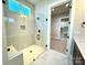 Glass shower showcasing black fixtures and marble-look tile, connected to the laundry area at 174 Fulworth Nw Dr # 65, Concord, NC 28027