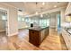 Open-concept kitchen with a dark island, pendant lighting, and stainless steel appliances at 174 Fulworth Nw Dr # 65, Concord, NC 28027